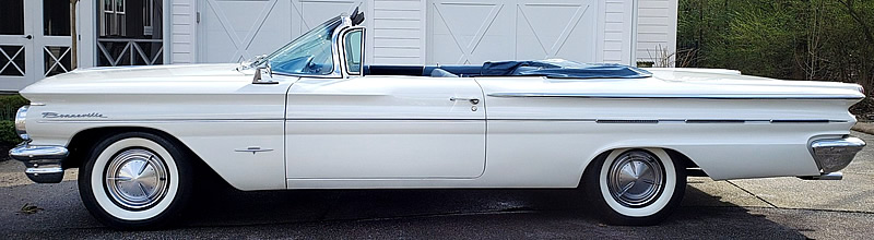 side view of a 1960 Pontiac Bonneville convertible with the top down