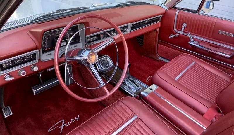 All vinyl interior with bucket seats inside a 65 Sport Fury Convertible
