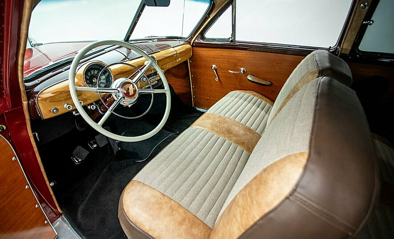 woodgrain dash and door panels inside a restored 1950 Ford Country Squire