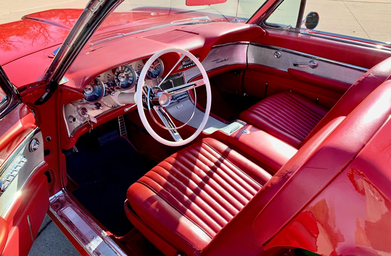 red vinyl bucket seat interior of a 61 Thunderbird