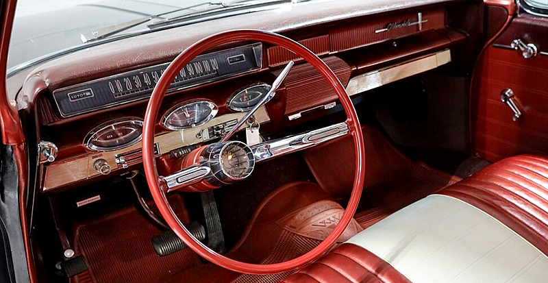 Futuristic dash and instrument panel of a 61 Olds 88