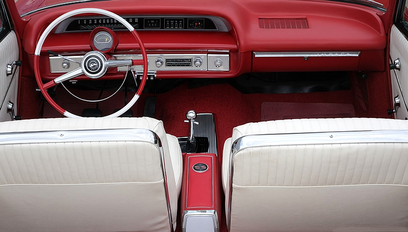 all-vinyl bucket seat interior of a 1964 Impala SS