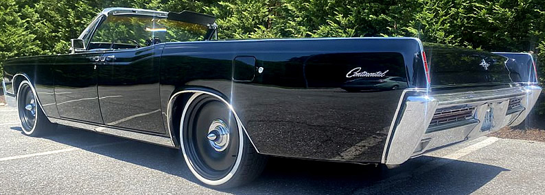 Rear view of a 67 Lincoln Continental Convertible with the top down
