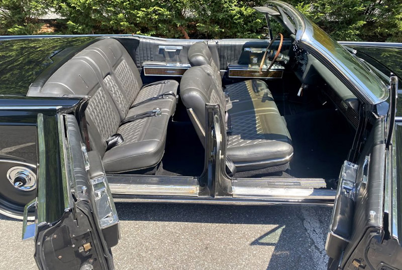 Suicide doors open on a 67 Lincoln continental