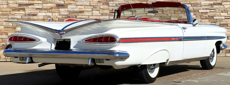 Rear view of a 1959 Chevy Impala convertible with the top down