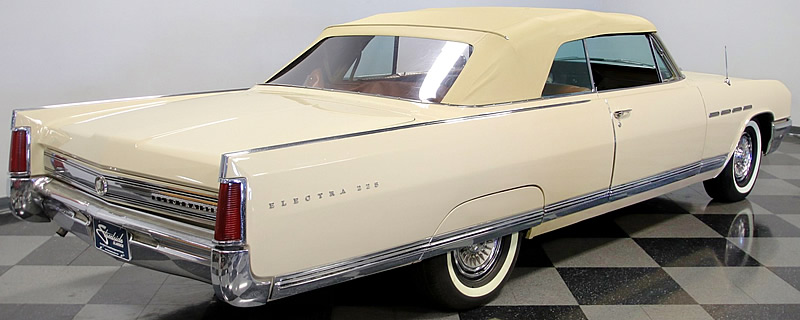 rear view of a 64 Buick Electra 225 convertible with the top up