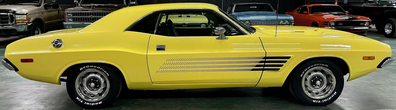 side view of a yellow 73 Dodge Challenger